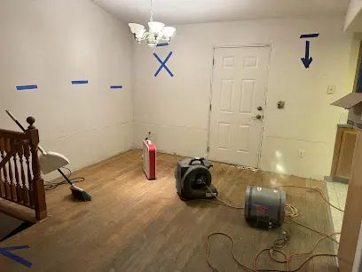 Moisture mapping marks on the walls of a Beaverton room being dried