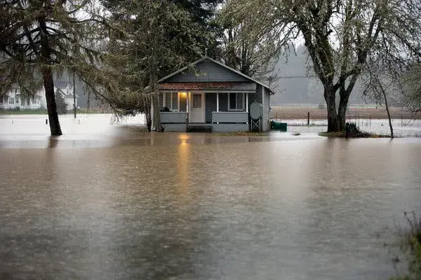 Floodwater surrounding a house during a Tualatin Valley storm
