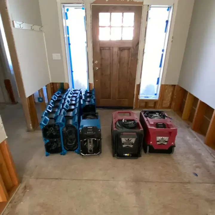 Air movers and dehumidifiers staged for a Beaverton water damage dry-out