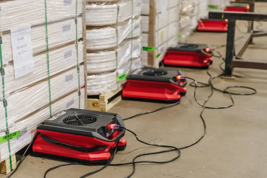 Air movers drying a commercial stockroom floor in Beaverton