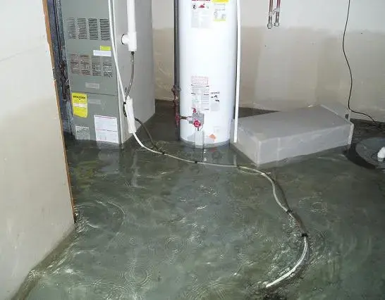 Water flooding a utility room after a sump pump failure in Beaverton